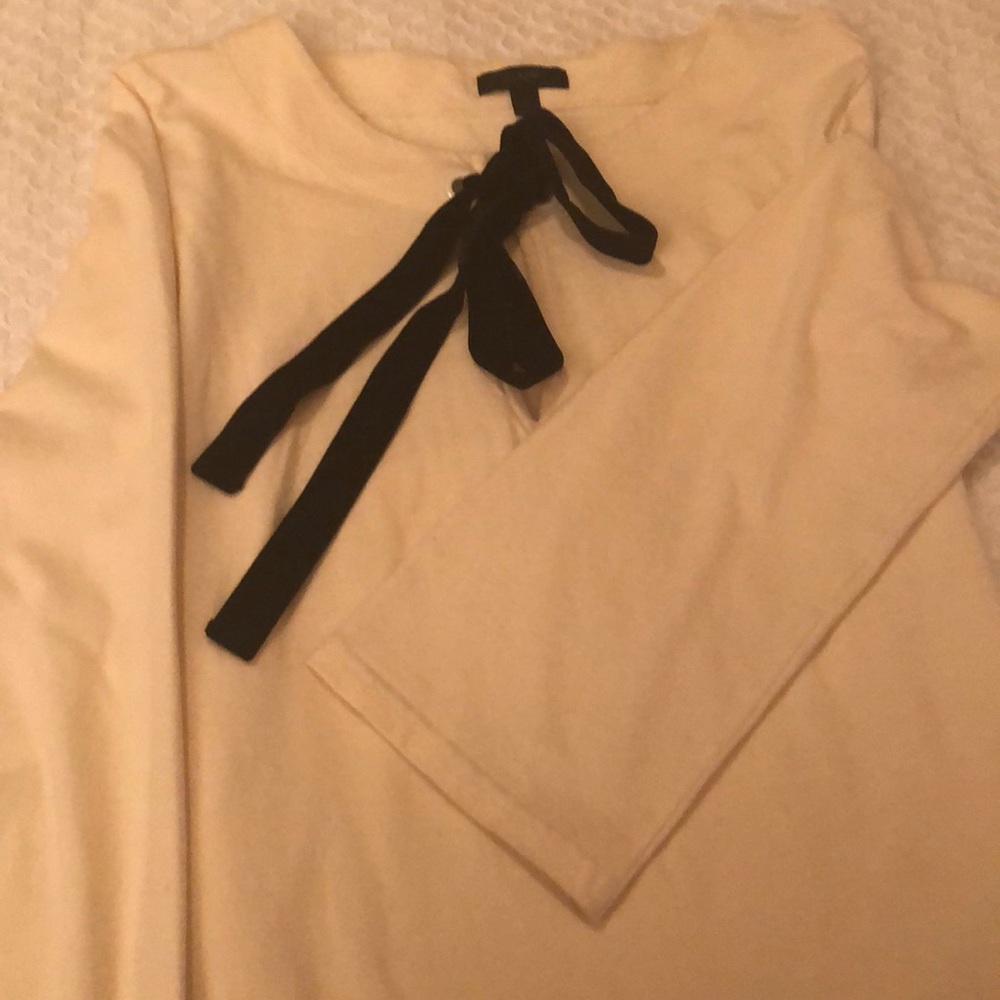 Cream color J crew top with black velvet bow